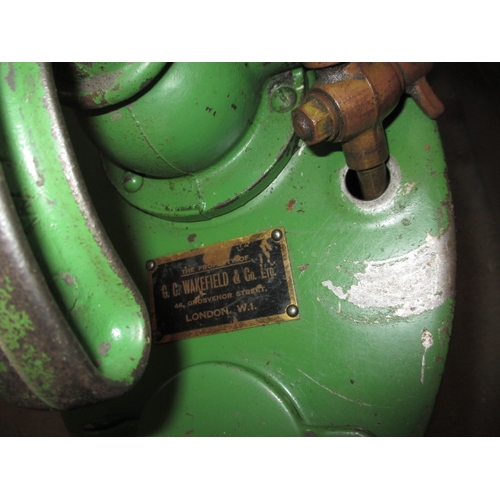 323 - A vintage Castrol gear oil dispenser, hand cranked with original hose, having general use-related ma... 