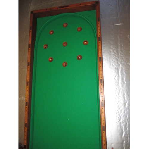 296 - An antique table top bagatelle board by Austin of St Andrews Street, Dublin, folds and packs away fo... 