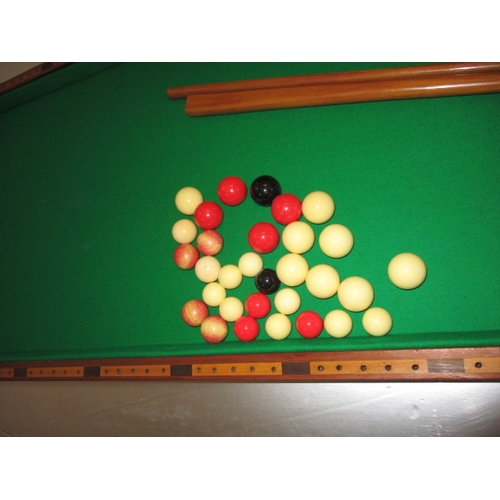 296 - An antique table top bagatelle board by Austin of St Andrews Street, Dublin, folds and packs away fo... 