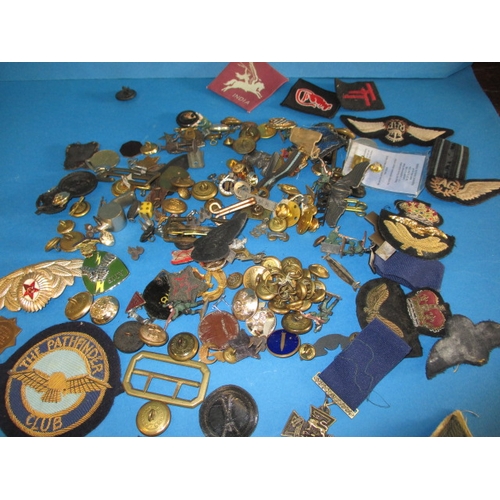 227 - A parcel of WWII and later military related insignia and miscellanea, all in used condition