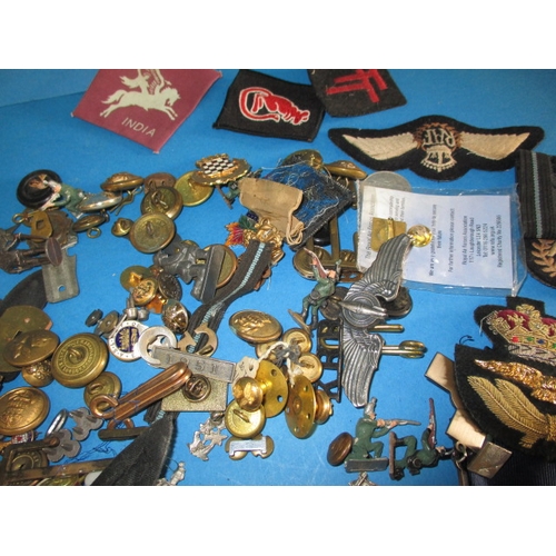 227 - A parcel of WWII and later military related insignia and miscellanea, all in used condition