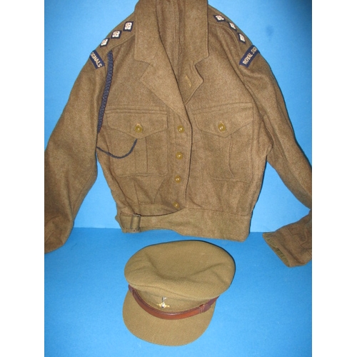 232 - A 1950 Royal Signals Captains battledress blouse and a REME officers peak cap, in used condition