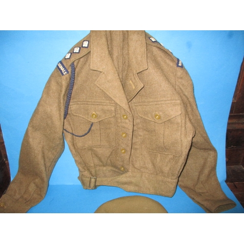 232 - A 1950 Royal Signals Captains battledress blouse and a REME officers peak cap, in used condition