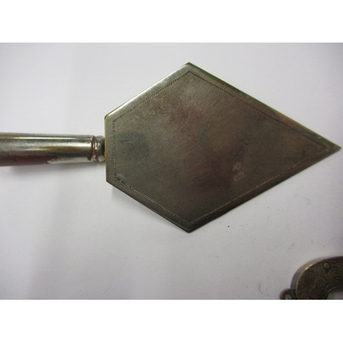 145 - A vintage white metal pistol charm with working mechanism and a decorative plated trowel, in useable... 