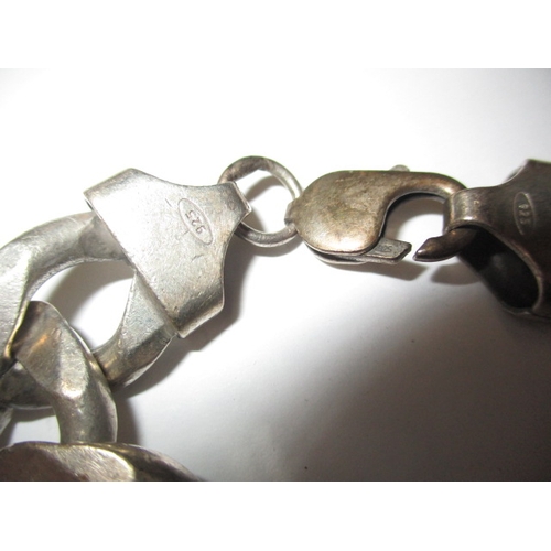 146 - A chunky 925 silver curb link bracelet, approx. linear length 22cm, approx. weight 94g, in useable p... 