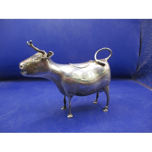 161 - A late 19th century Dutch sterling silver cow creamer, having marks to underside C1895, in useable p... 