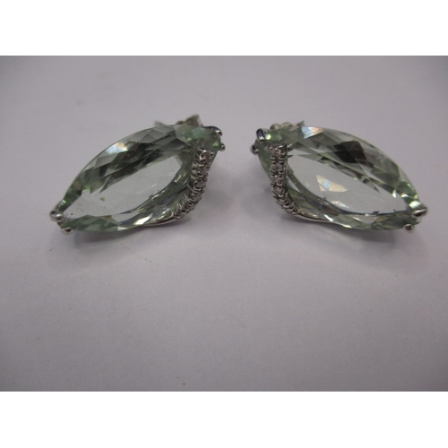 72 - A pair of 18ct white gold diamond and aquamarine earrings, the main stones measuring approx. 18x10mm... 