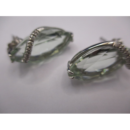 72 - A pair of 18ct white gold diamond and aquamarine earrings, the main stones measuring approx. 18x10mm... 