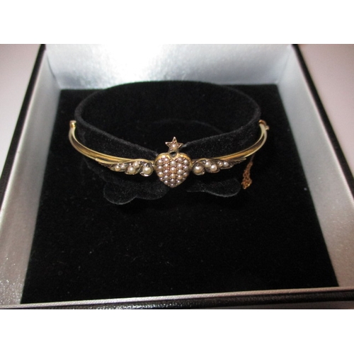 A vintage 15ct yellow gold and seed pearl bangle, approx. gross weight 5.9g, in good useable pre-owned condition