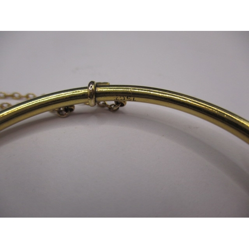 73 - A vintage 15ct yellow gold and seed pearl bangle, approx. gross weight 5.9g, in good useable pre-own... 