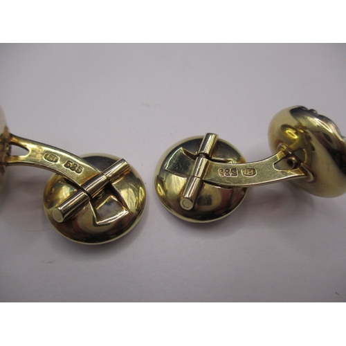 74 - A pair of 585ct gold cufflinks with mother of pearl panel and a small central diamond to each face, ... 