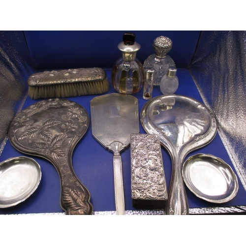 163 - A parcel of silver and white metal mounted dressing table items, various dates and makers, all in us... 