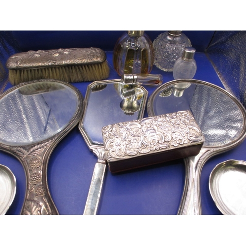 163 - A parcel of silver and white metal mounted dressing table items, various dates and makers, all in us... 