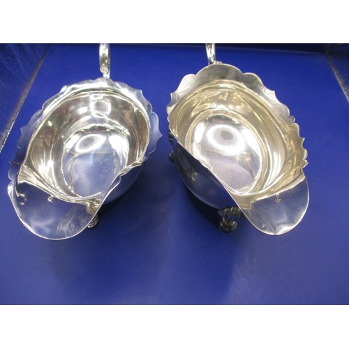 165 - Two sterling silver sauce boats, different ages, approx. parcel weight 590g, in good used condition