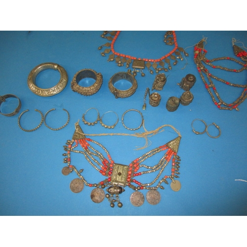 182 - A parcel of vintage Bedouin/Yemen white metal jewellery to include marriage necklaces, all in used c... 