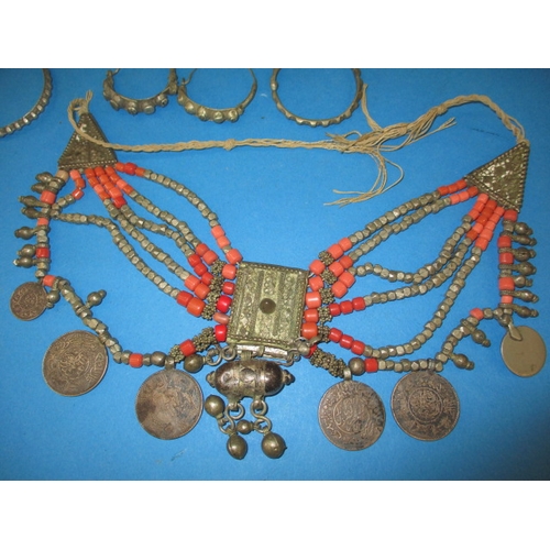 182 - A parcel of vintage Bedouin/Yemen white metal jewellery to include marriage necklaces, all in used c... 