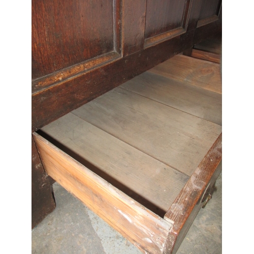 287 - An antique panel constructed mule chest, having drawers below storage box, in well used condition an... 