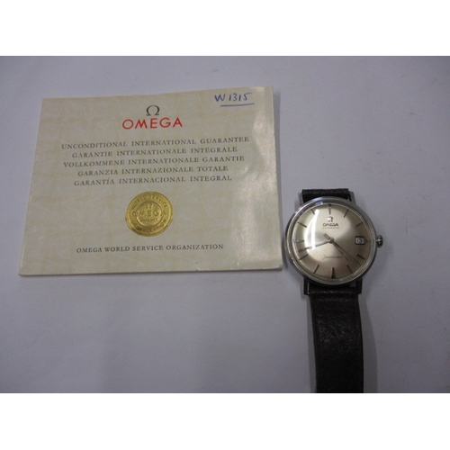 96 - A 1960s Omega Seamaster automatic watch with date window, runs with age related marks, paperwork but... 