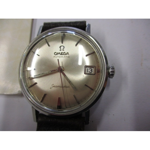 96 - A 1960s Omega Seamaster automatic watch with date window, runs with age related marks, paperwork but... 