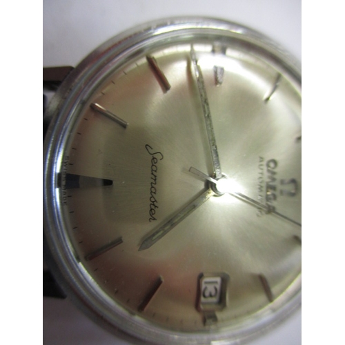 96 - A 1960s Omega Seamaster automatic watch with date window, runs with age related marks, paperwork but... 