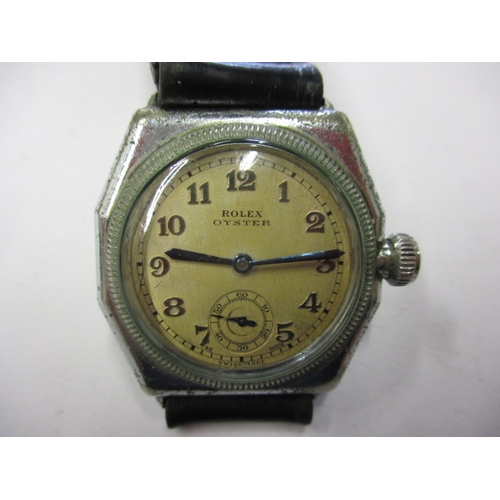 97 - A 1920s/30s gents Rolex Oyster cushion case wrist watch, runs when wound and with considerable use r... 