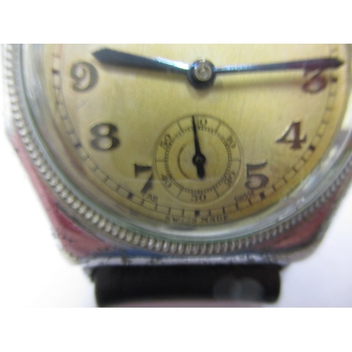 97 - A 1920s/30s gents Rolex Oyster cushion case wrist watch, runs when wound and with considerable use r... 