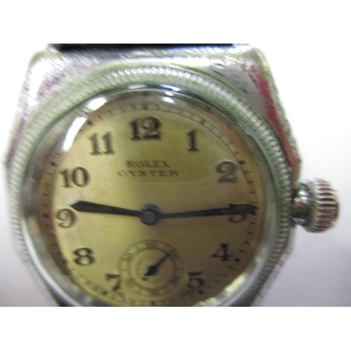 97 - A 1920s/30s gents Rolex Oyster cushion case wrist watch, runs when wound and with considerable use r... 