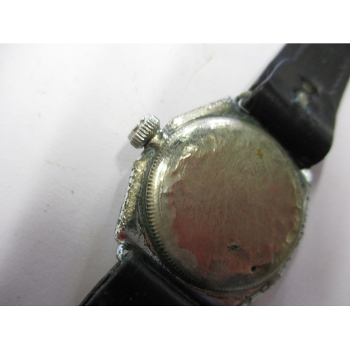 97 - A 1920s/30s gents Rolex Oyster cushion case wrist watch, runs when wound and with considerable use r... 