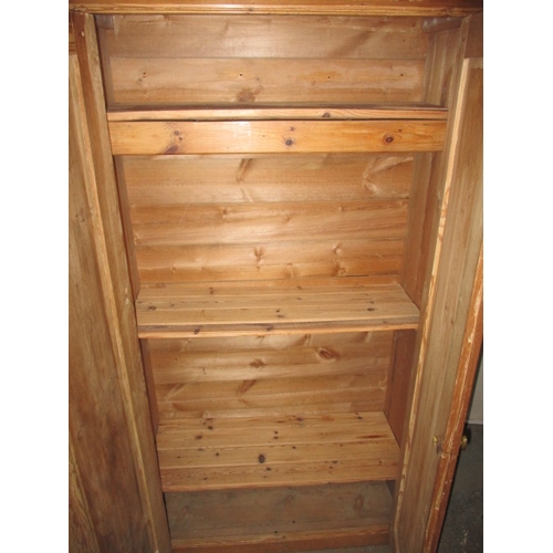 283 - A vintage double door, natural pine wardrobe with fitted shelving to interior. In useable, pre-owned... 