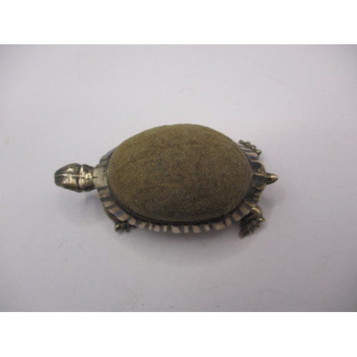 187 - A vintage sterling silver pin cushion in the form of a tortoise, in good used condition, approx. len... 