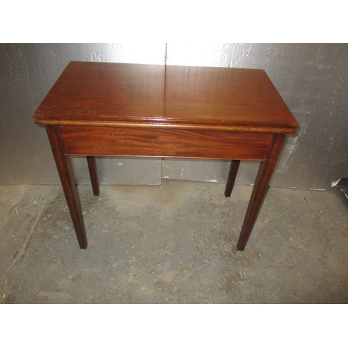 290 - A 19th Century mahogany fold-out tea table. In useable, pre-owned condition, with age related marks ... 