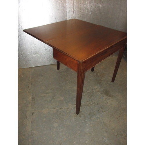 290 - A 19th Century mahogany fold-out tea table. In useable, pre-owned condition, with age related marks ... 