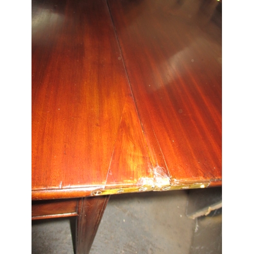 290 - A 19th Century mahogany fold-out tea table. In useable, pre-owned condition, with age related marks ... 