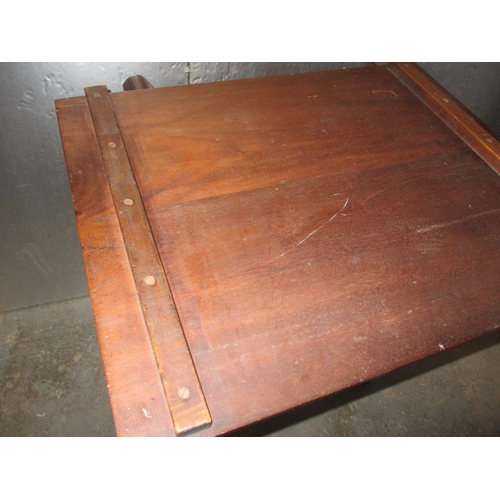 291 - An antique mahogany butler table. Lift off top and collapsible stand. Approximate height 85cm, width... 