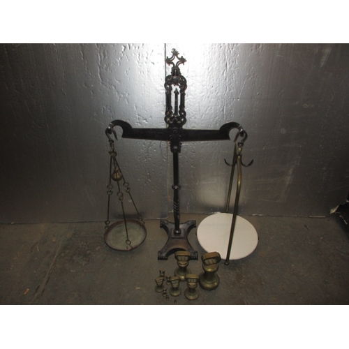 328 - A 19th Century cast iron shop balance scales with period weights, Victorian and Georgian stamps to w... 