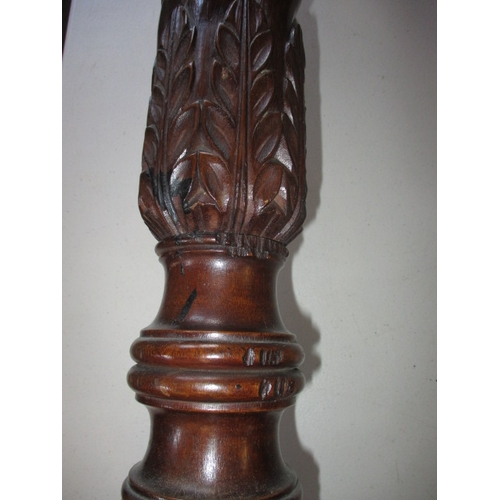 292 - A vintage mahogany torchiere with spiral turned column and associated top. In good useable condition... 