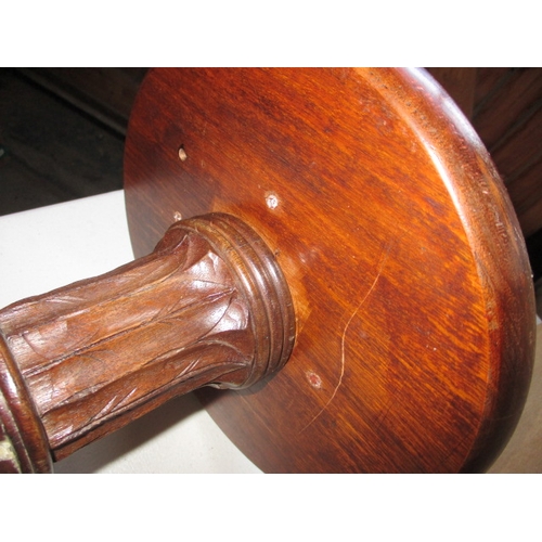 292 - A vintage mahogany torchiere with spiral turned column and associated top. In good useable condition... 