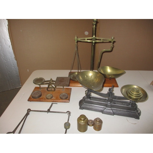 332 - A quantity of Victorian and later balance scales and weights. To include one example by Parnall & So... 