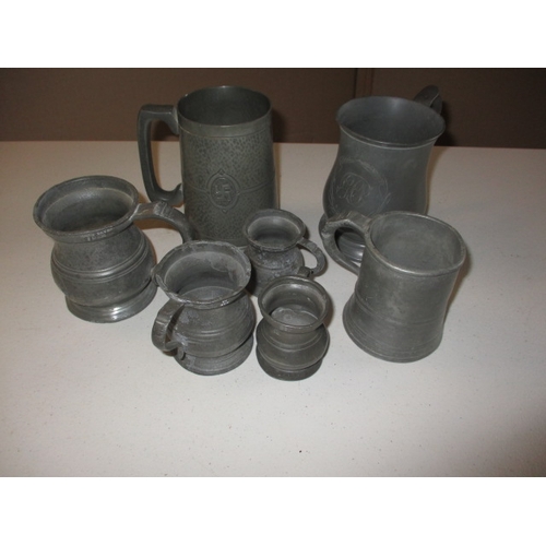 330 - A quantity of antique and later pewter tankards and measures. In good pre-owned condition