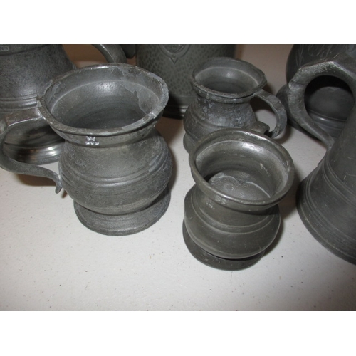 330 - A quantity of antique and later pewter tankards and measures. In good pre-owned condition