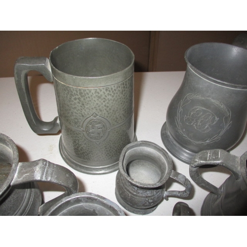 330 - A quantity of antique and later pewter tankards and measures. In good pre-owned condition