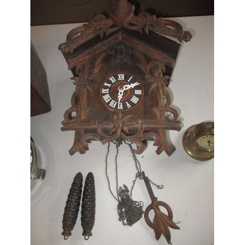 331 - 3 vintage clocks, to include a pigeon racing clock? and a cuckoo clock. None tested to function, all... 