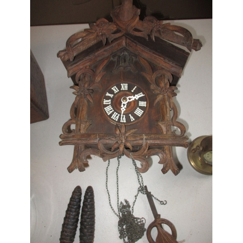 331 - 3 vintage clocks, to include a pigeon racing clock? and a cuckoo clock. None tested to function, all... 