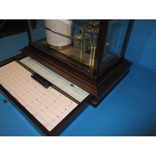 286 - A vintage barograph in mahogany glazed case, in working order with general use-related marks