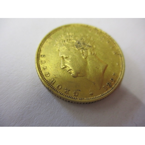 123 - A George IV full gold sovereign dated 1825, a circulated coin with very good definition of features,... 