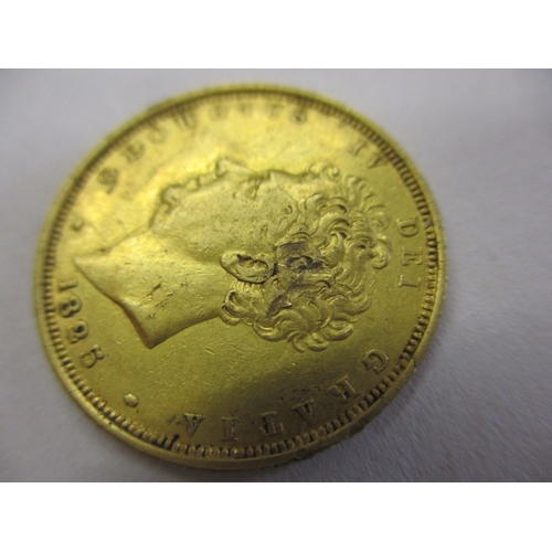 123 - A George IV full gold sovereign dated 1825, a circulated coin with very good definition of features,... 