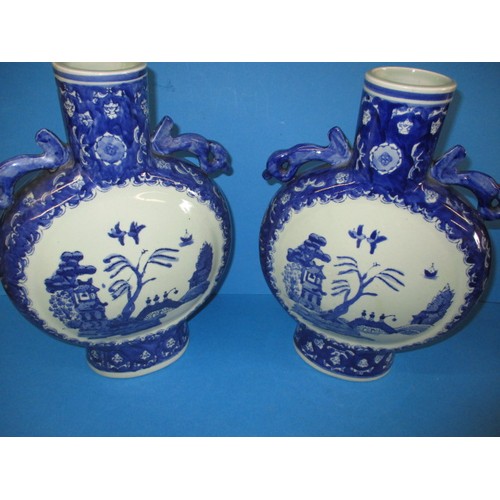 317 - Two vintage oriental ceramic moon flasks, each approx. 34cm high, both in good used condition with n... 