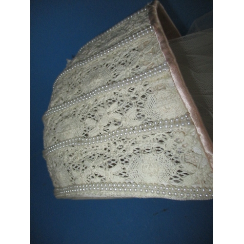 62 - A vintage lace veil and train, with integral head cap, in used condition