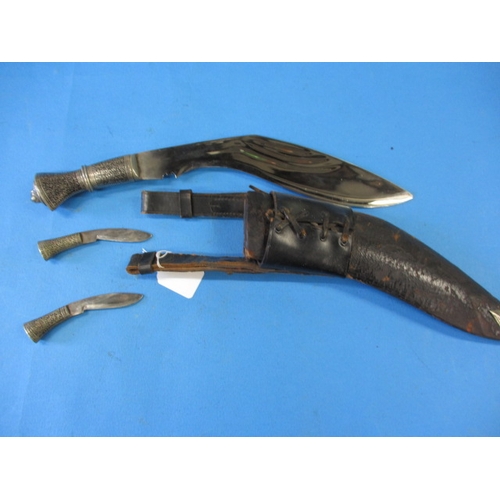 66 - An Indian kukri knife in leather sheath in good pre-owned condition