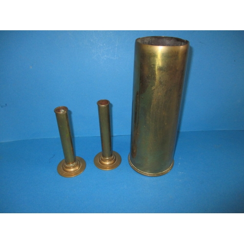 74 - A WWI 13lb brass shell case and two brass detonator tubes from shell cases, all in used condition